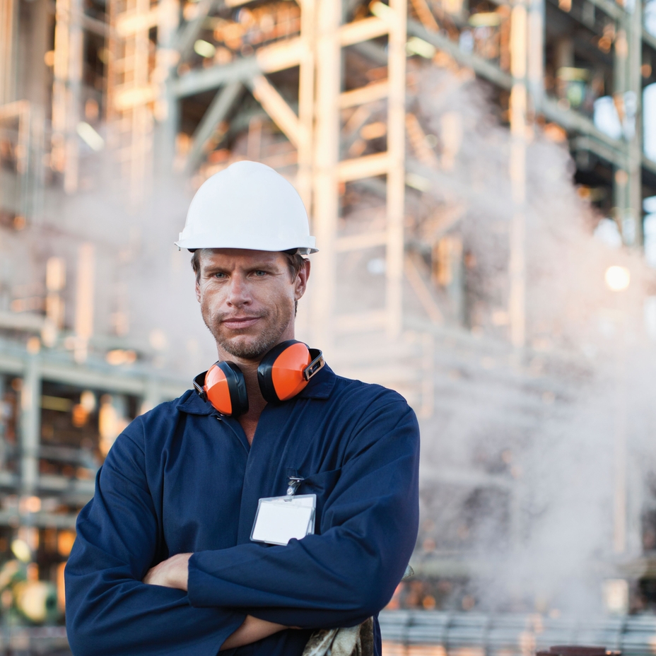 Worker with steam in the background