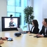 Customers watching a online seminar of Endress+Hauser in a meeting room